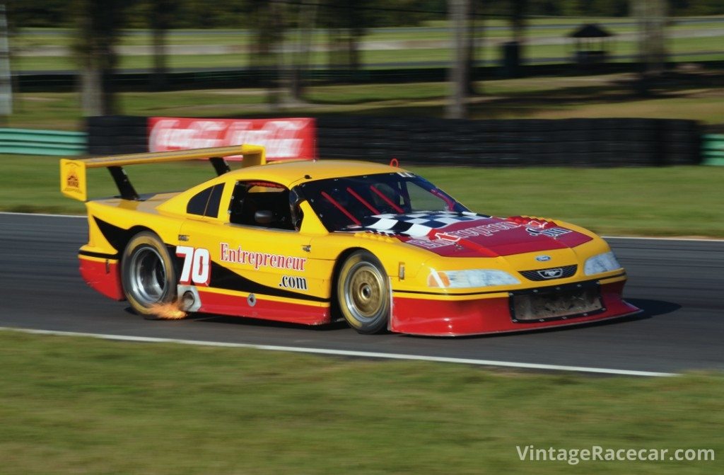 Debbie CloudÕs Trans-Am Mustang breathes fire as she races toward turn 4.Photo: Fred Lewis 