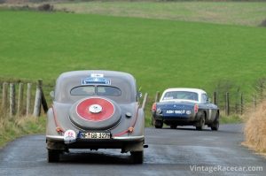 Gerd Buehler and Jose Romeo de SousaÕs BMW 327/328 head down off the moors to Simonsbath. Peter Collins