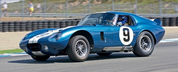 Rob Walton's 1965 Cobra Daytona Coupe accelerates out of turn Eleven.