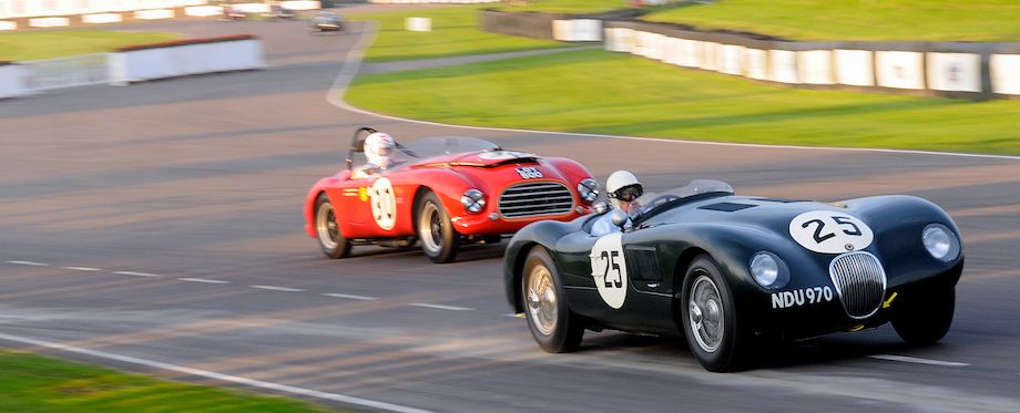 Stirling Moss in the Jaguar C-Type tries to stay clear of the Tojeiro-Bristol