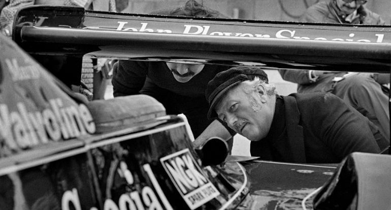 Colin Chapman inspects the back of Mario Andretti's Lotus 79