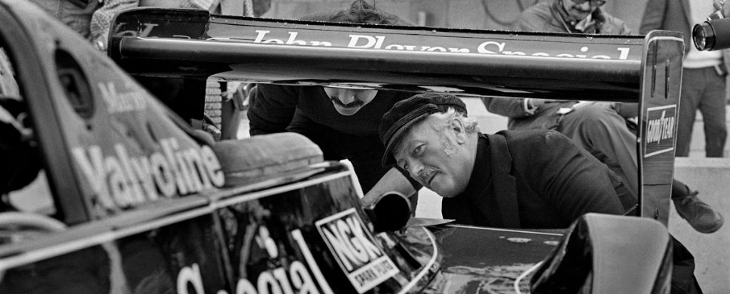 Colin Chapman inspects the back of Mario Andretti's Lotus 79