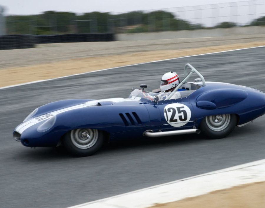 Erickson Shirley's 1959 Lister Costin Chevrolet enters The Corkscrew. DennisGray