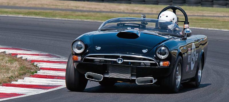 Mark Sorsdahl's 1964 Sunbeam Tiger powering through Turn 12