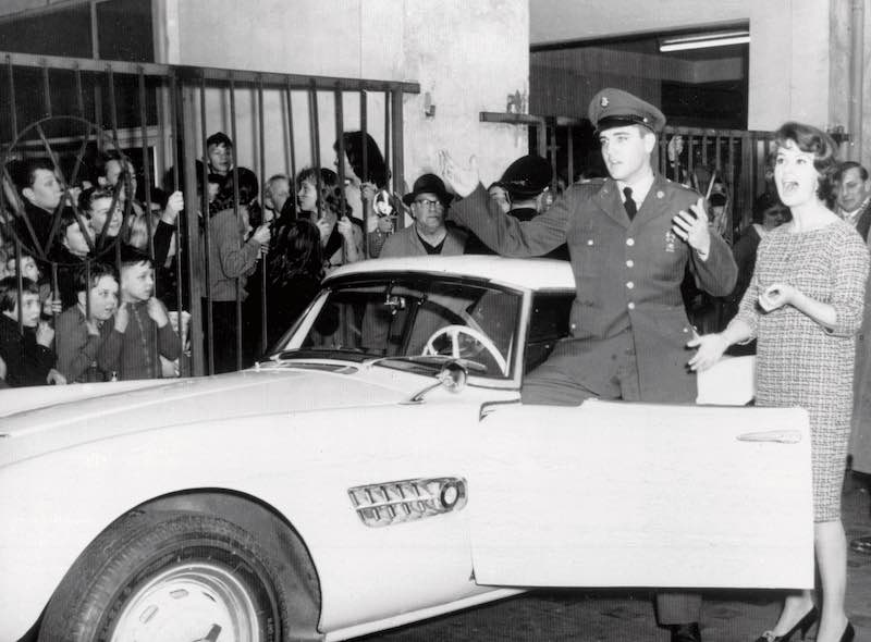 Elvis Presley in front of his BMW 507