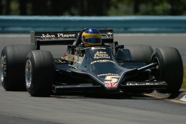 Duncan Dayton, rides up on the curbing in Mario Andretti's 1978 Lotus 79.