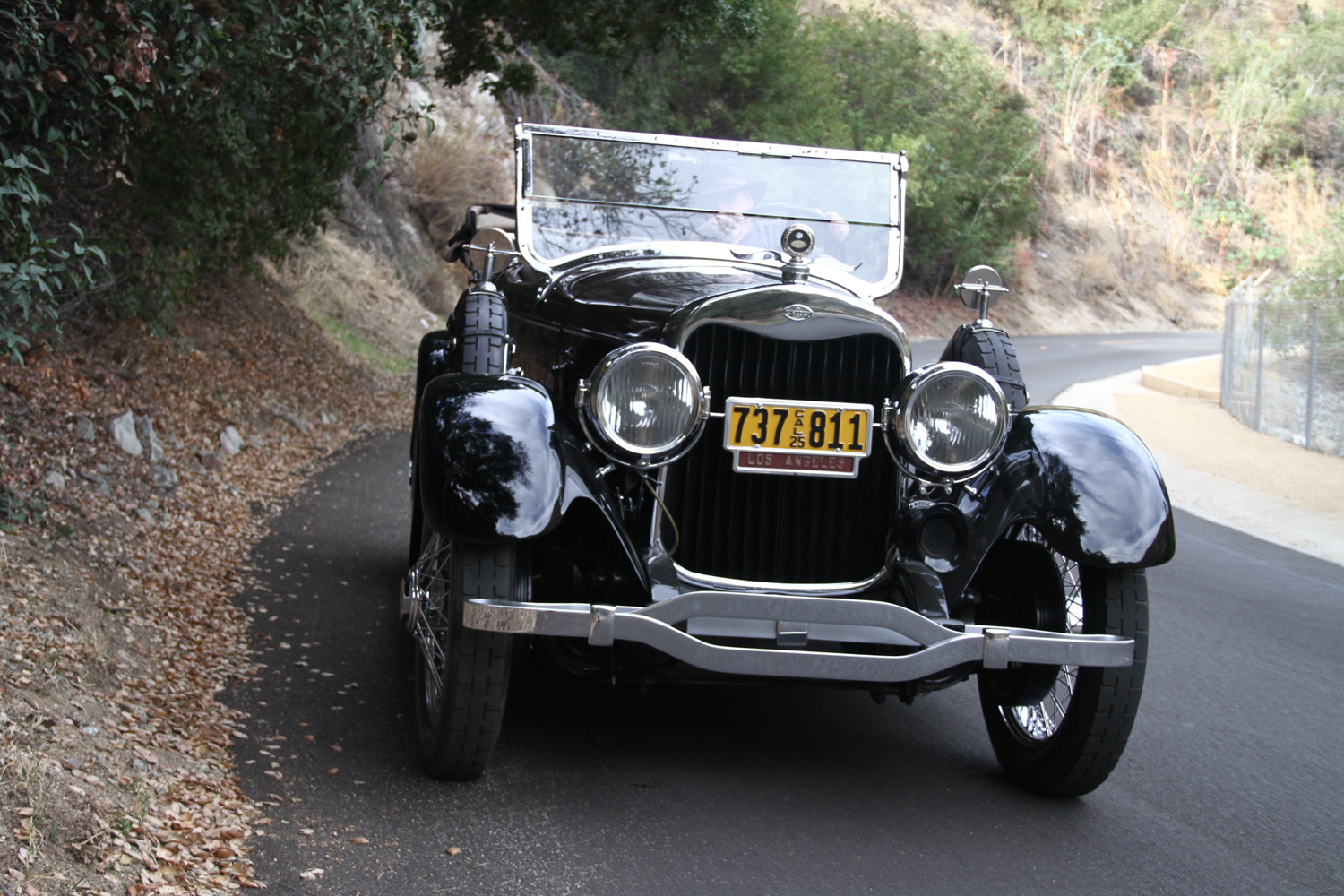 Front view of the front end and engine bay of a 1925 brown Lincoln Phaeton