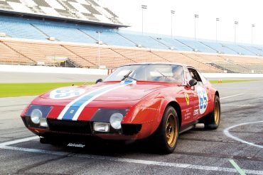 John Giordano pulls onto the pitlane in his 1973 Ferrari Daytona.