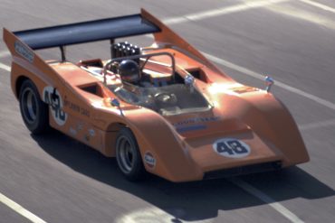 Dan Gurney wrenches a few more tenths from a McLaren M8. Photo: Pete Lyons