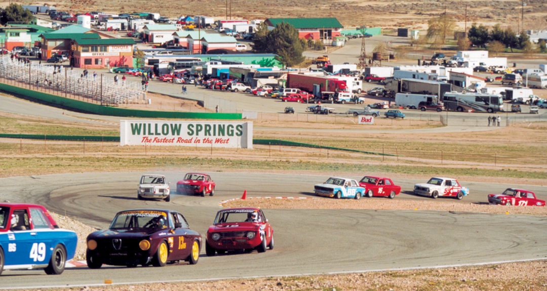 The 20-plus car field charges through turns 3 & 4 on the opening lap.