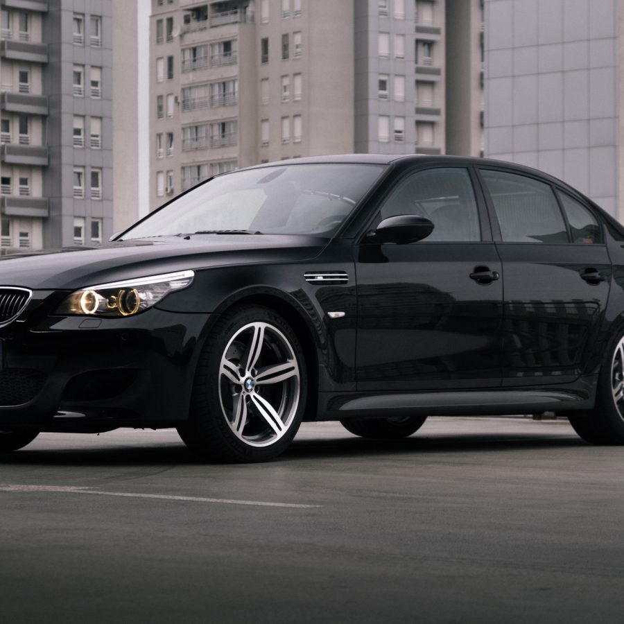 Front view of BMW M5 E60 on rooftop in city