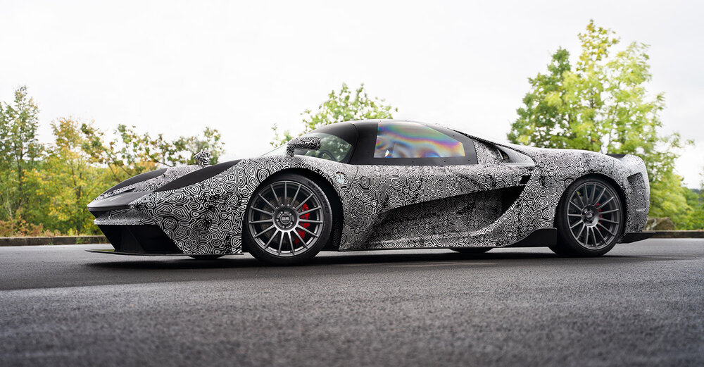 SCG 004 parked on road with trees in background