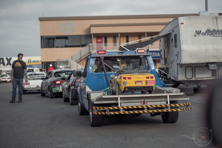 LeMons racecars lined up and ready to enter the track