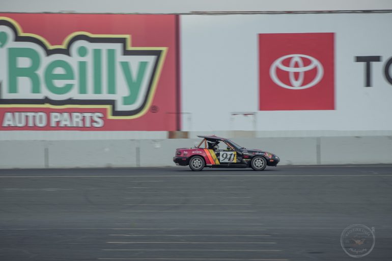 1992 Mazda Miata driven by Team mYota Racing heads towards Turn 11