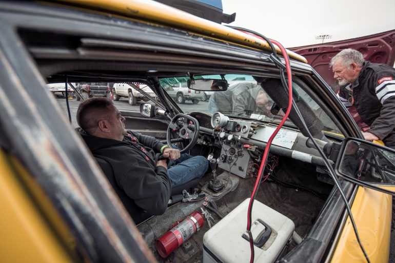 Team Shit Box Racing works on their 1982 Mazda Rx7