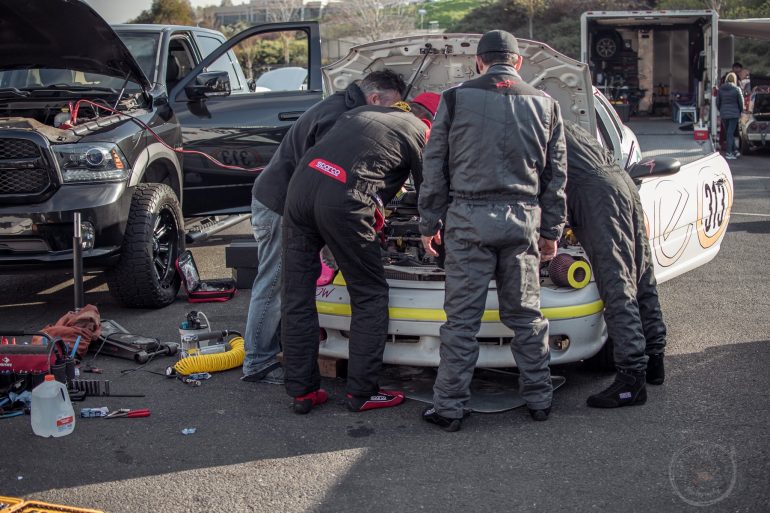 Team Neon Challenged works on their 1998 Dodge Neon