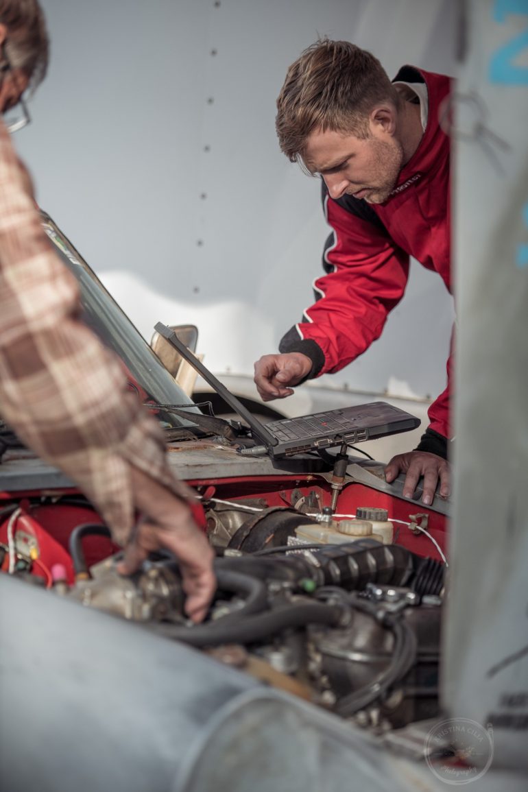 Team Scuderia Limoni works on their 1986 Alfa Romeo Spider