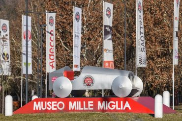 Sign and sculpture outside Mille Miglia Museum