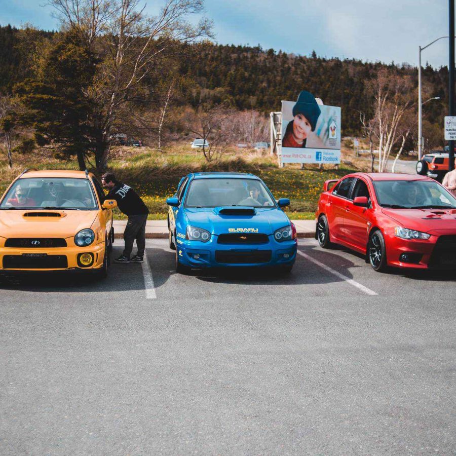 Subaru Imprezas and a Lancer Evolution on a Car Meet