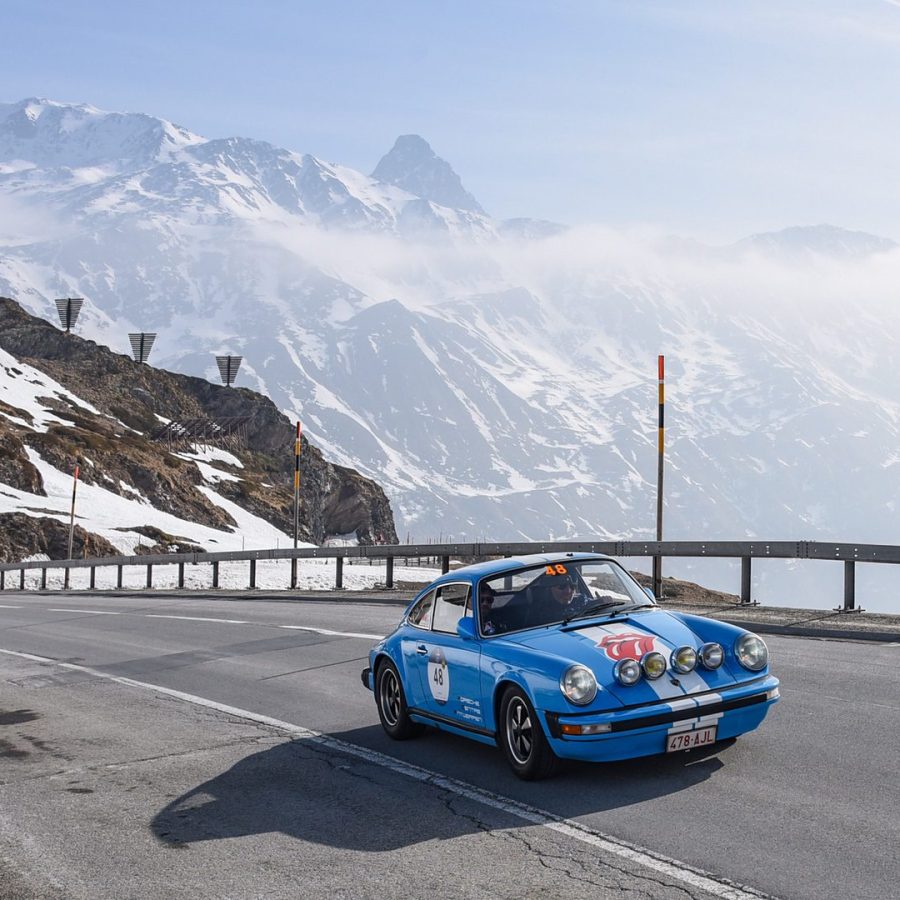 Car on snowy mountain pass during Coppa delle Alpi