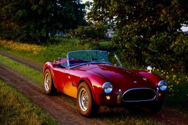 Tom Cotter's Ford Cobra on dirt road in country