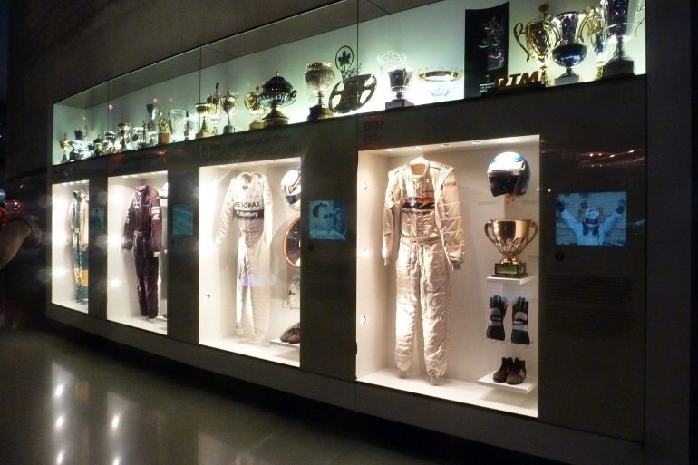 Display of racing apparel at Mercedes-Benz museum in Germany