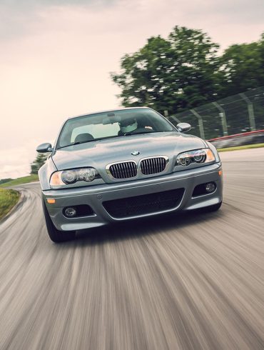 Silver BMW M3 E46 on a racetrack