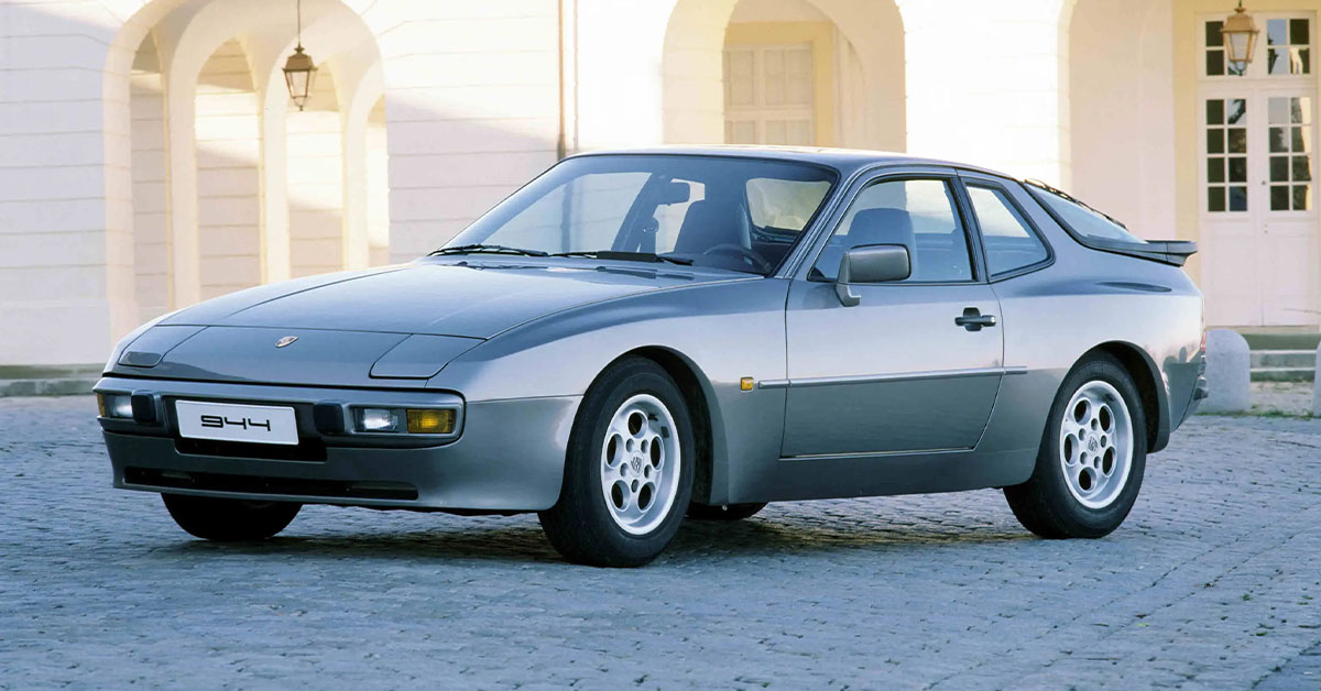 Photo of a silver Porsche 944 on a city street